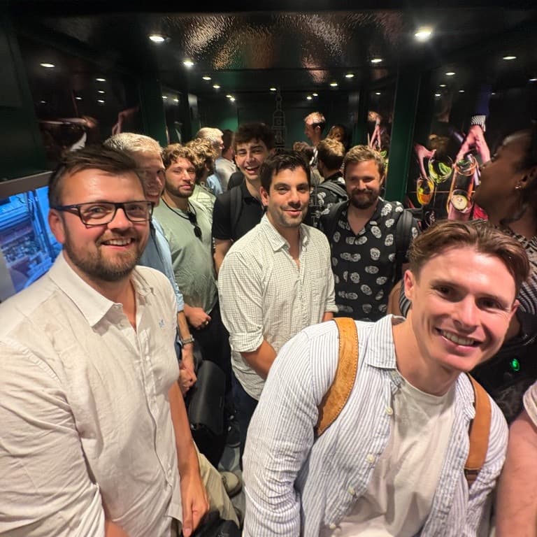 Stitch team squeezed into a lift on a night out