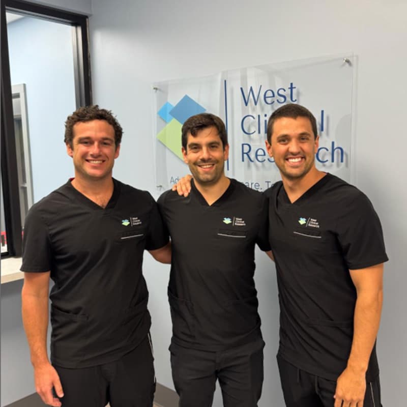 A member of the Stitch team in scrubs with the West Clinical Research team during a site visit