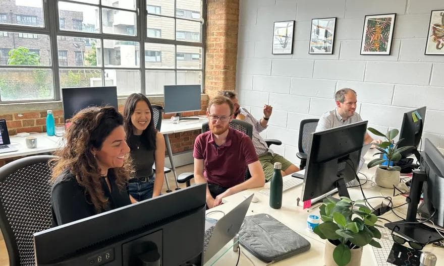 The Stitch team working together in the office